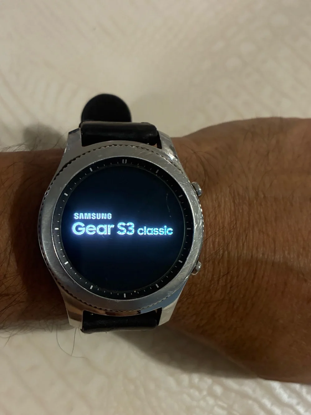 Samsung Silver Smartwatch with Black Strap and Blue Display